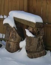stacked logs in the snow